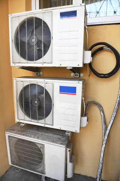 Air conditioning system on the wall of the building.Air conditioners are installed nearby.