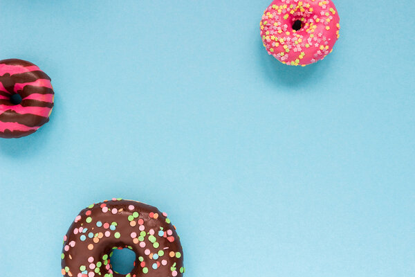 Sweet donuts on the blue background.