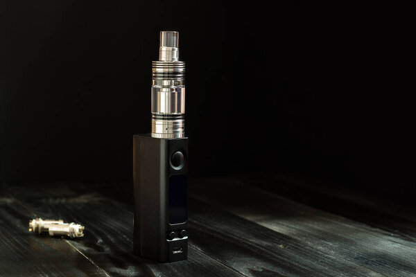 Vape or e-cigarette. Vaping set on the table.