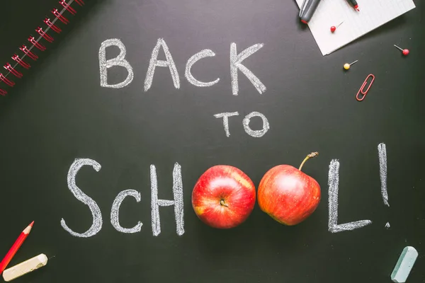 Back to school. School supplies on the blackboard background, education concept — Stock Photo, Image