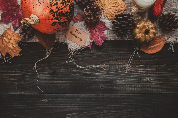 Thanksgiving background. Thanksgiving decoration on the wooden table, top view