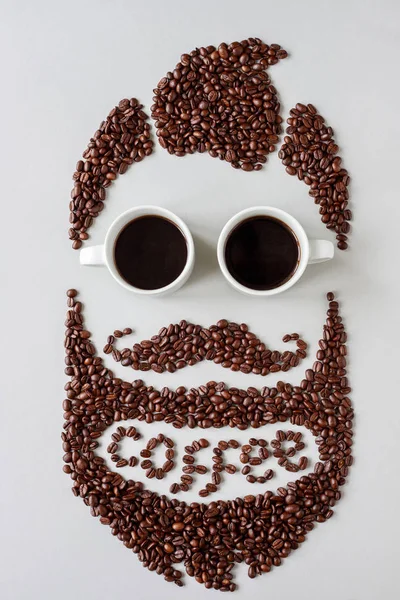 Kahve kavramı. Sakallı hippi insan kahve çekirdekleri kahve fincan yapılan gözlük ile yapımı — Stok fotoğraf