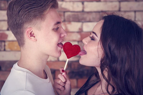 Young Loving Couple Kiss Each Other Cover Lips Candy Form — Stock Photo, Image