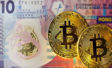 gong kong bir banknot arka plan karşı sikke bitcoin