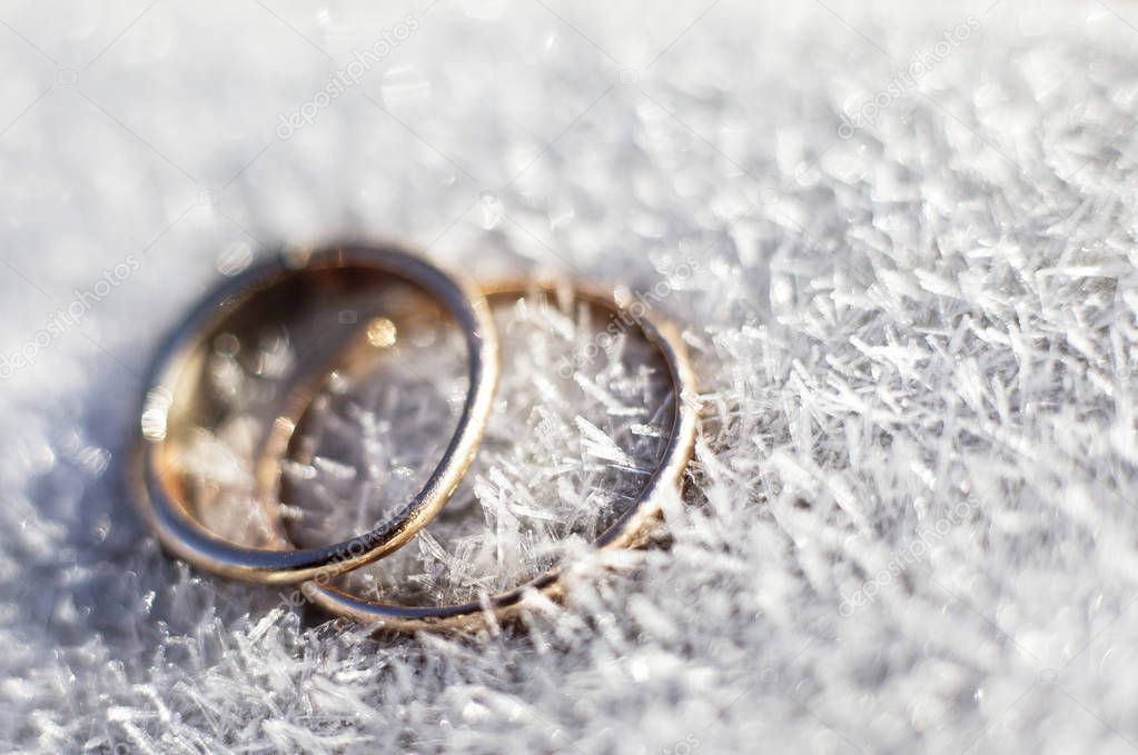 two wedding rings on snow