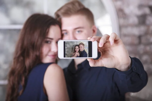 Young couple taking selfie in the city 15897227 Stock Photo at Vecteezy