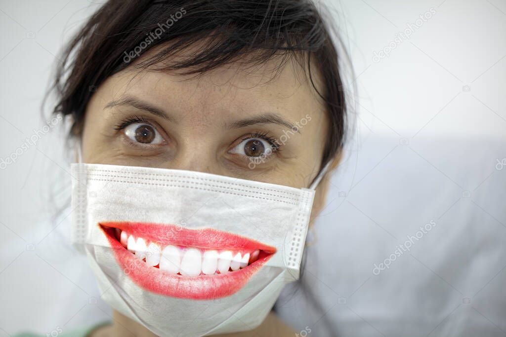 Concept of coronavirus quarantine, new virus - covid-19, woman urges everyone to wear masks, the mask shows a beautiful smile