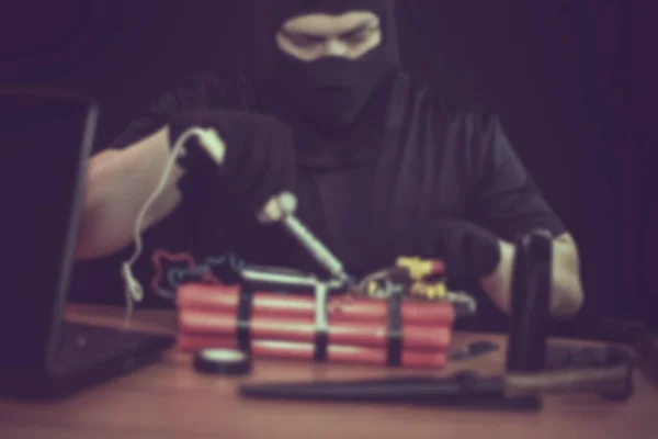 Masked Terrorist Preparing Explosive Device Soldering Iron Hand Indoors Table — Stock Photo, Image