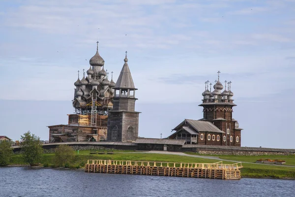 Kizhi island, Onega lake, Karelia, Russia.  In the foreground Orthodox Church of the Intercession of the Virgin in Kizhi Pogost.