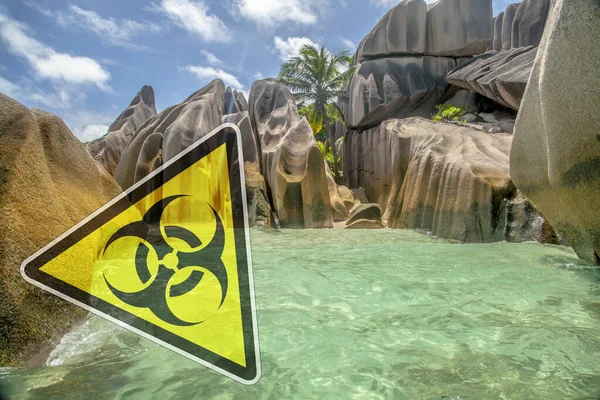 Quarantine action in Seychelles. Sign biological danger on beach Seychelle islands.