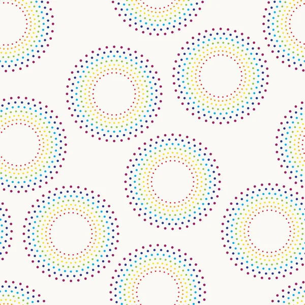 Naadloos patroon met gestippelde cirkels in regenboog kleuren. — Stockvector