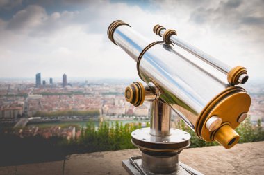 Telescope directed towards the city of Lyon, France clipart