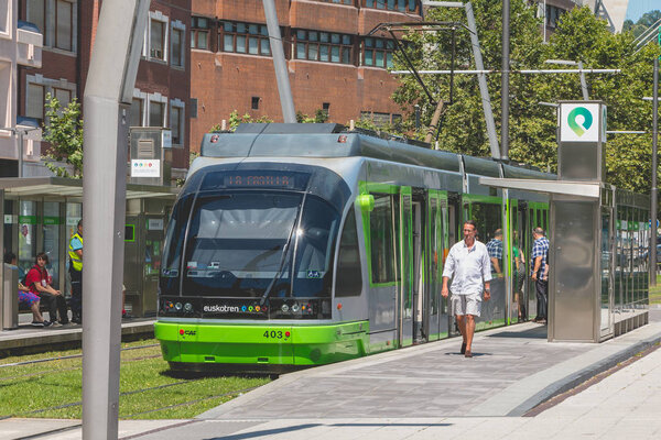 Tramway stops at a station in the city of Bilbao, Spain
