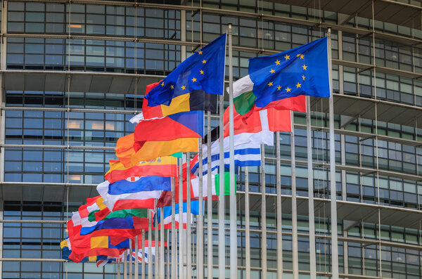 Set of European flags in front of the European Parliament