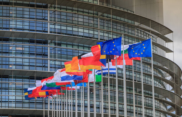 Set of European flags in front of the European Parliament