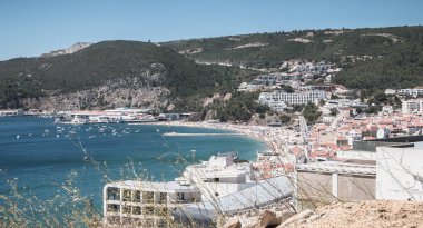 aerial overview of beaches and beach town center of Sesimbra, Po clipart