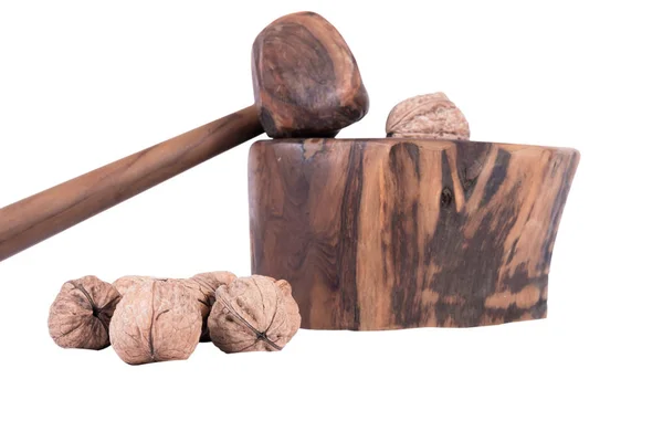 Wooden nutcracker with hammer and some nuts — Stock Photo, Image
