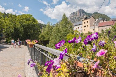 atmosphere and architecture of a small Spanish village in the Pyrenees mountains in Bielsa, Spain clipart