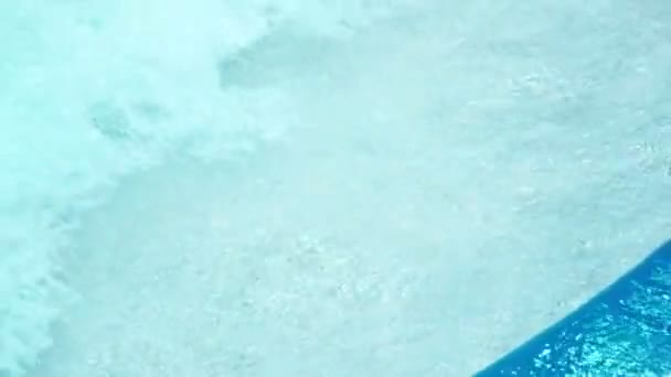 Blue water in swimming pool. Waves water background in swimming pool. — Stock Video