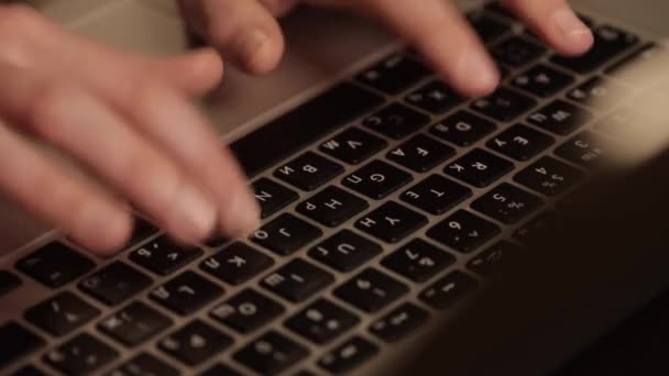 White Female hand with a ring on her finger, typing on the keyboard — Stock Video