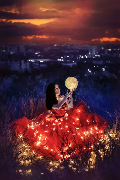 Beautiful woman with moon and lights