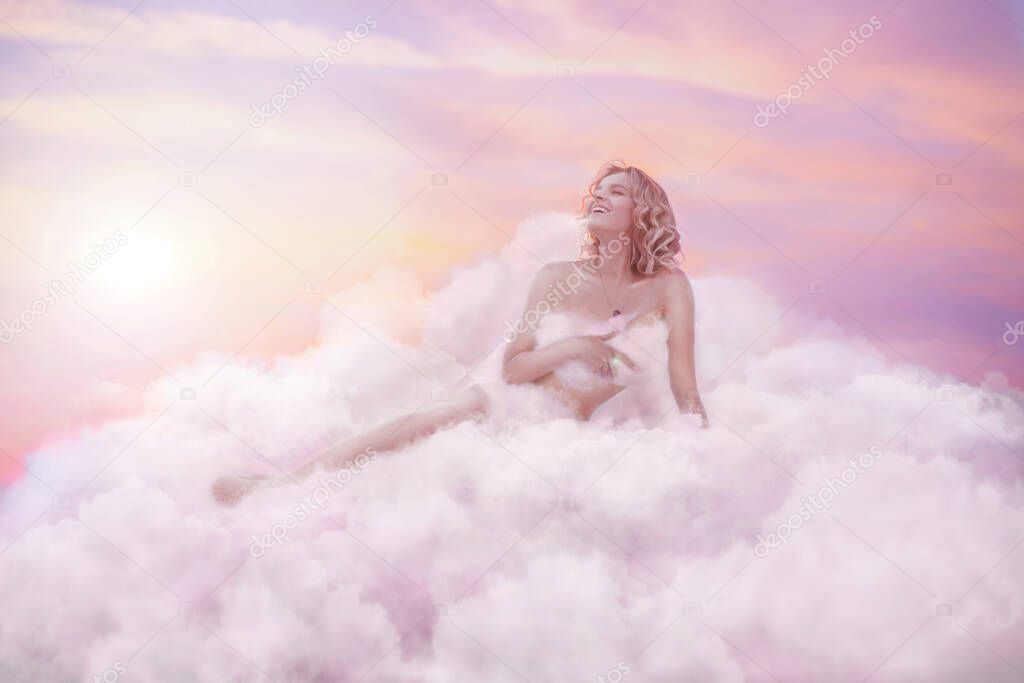 Beautiful woman in pink clouds