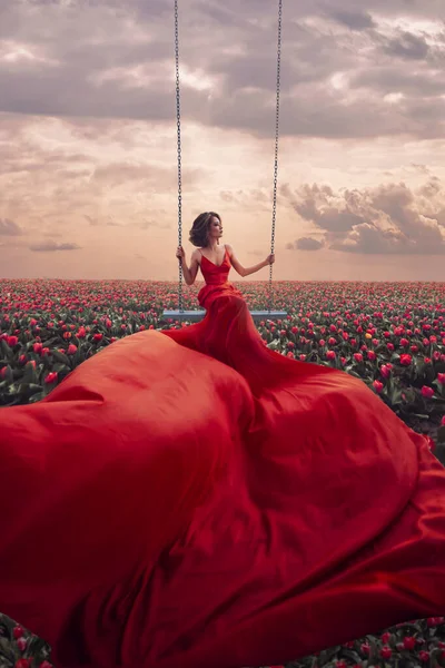 Beautiful woman in tulips field