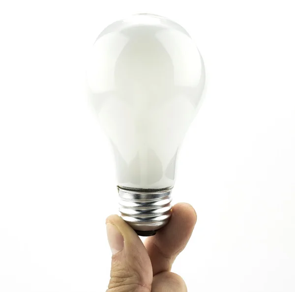 Lightbulb held with two fingers isolated on white Stock Image