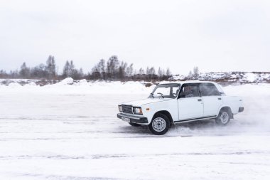 Russia, Novosibirsk - November 30, 2019. Russian white old low car 