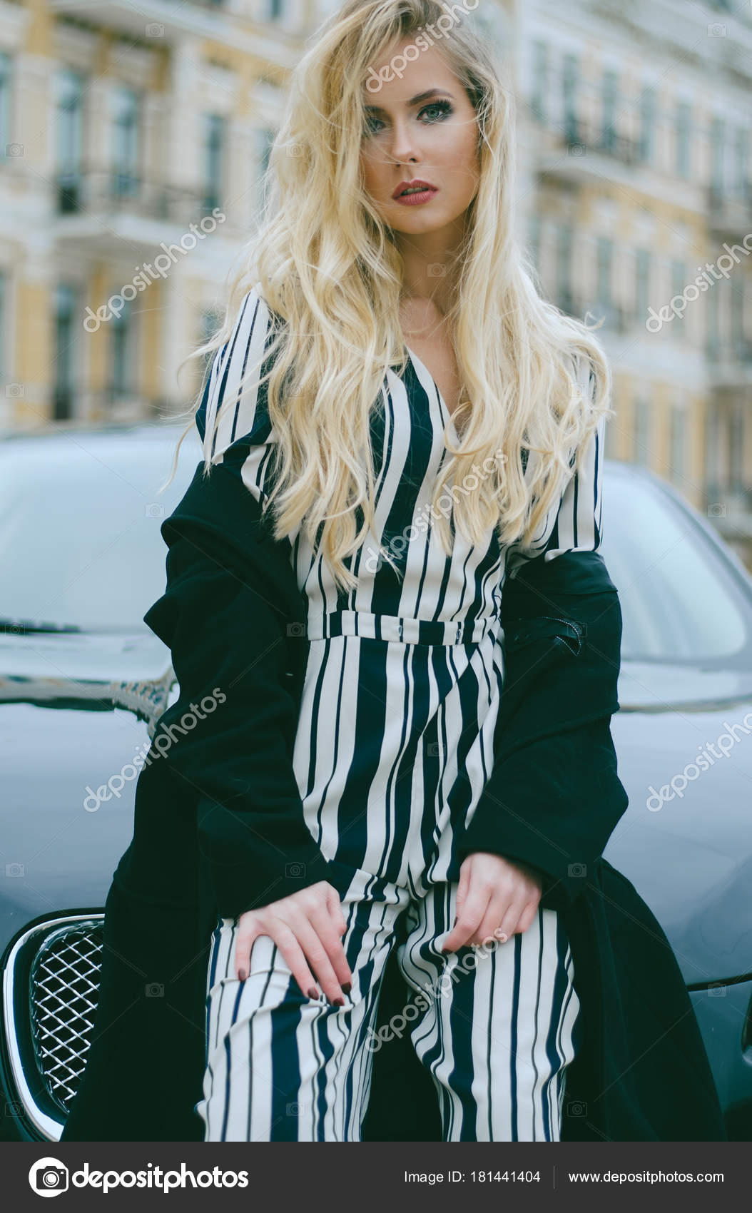 Beautiful Fashionable Blonde Long Hair Black Coat Striped Overalls