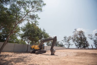 kazıcı, bir inşaatta kazıcı