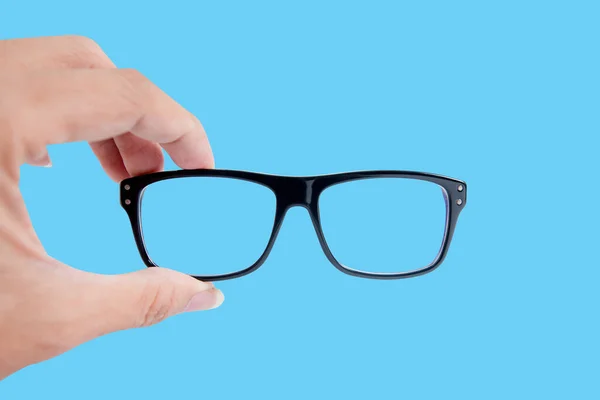 青い背景に隔離された眼鏡 — ストック写真