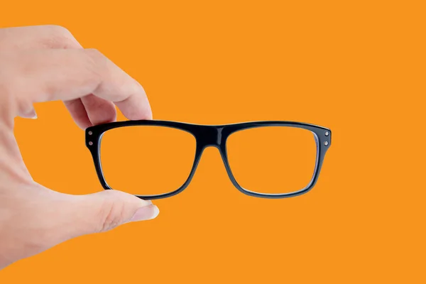 オレンジの背景に隔離された眼鏡 — ストック写真