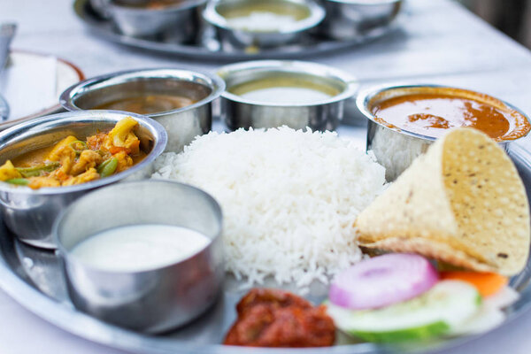Close up on Indian dal bhat served with steamed rice and lentil soup