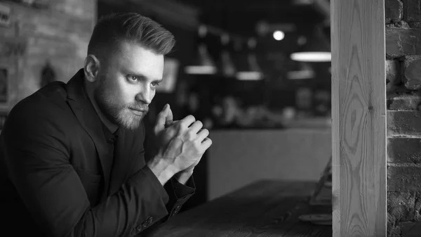 office worker over dark cafe background. Black and white.