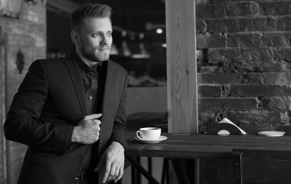 office worker over dark cafe background. Black and white.