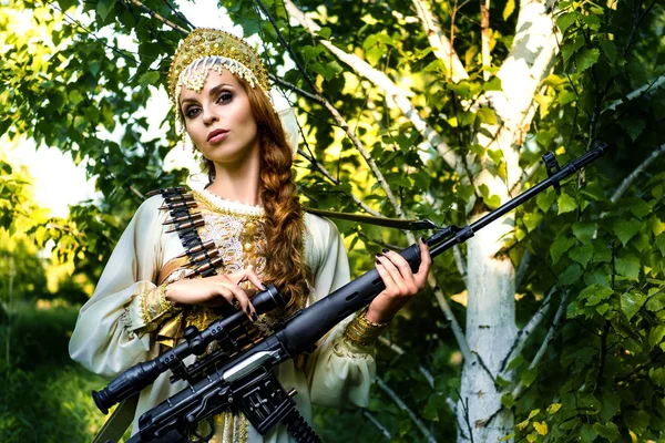 Woman in national russian wear with the russian sniper rifle