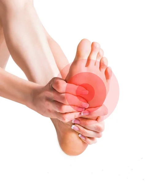 Масаж жіночих ніг. Біль у нозі. Ізольовані на білому тлі . — стокове фото