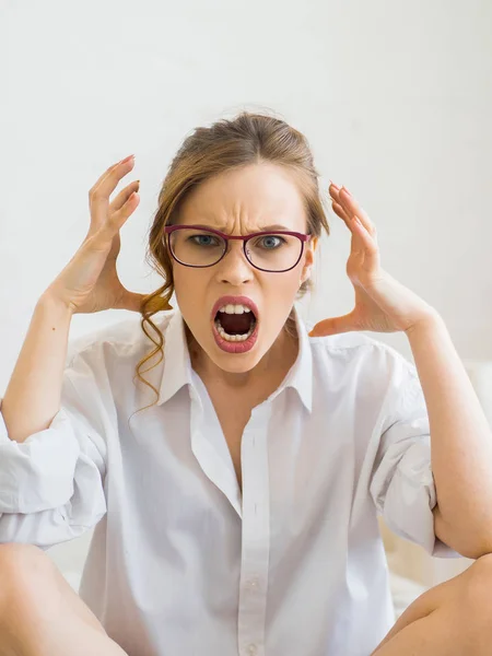 Furious and frustrated woman screaming with rage