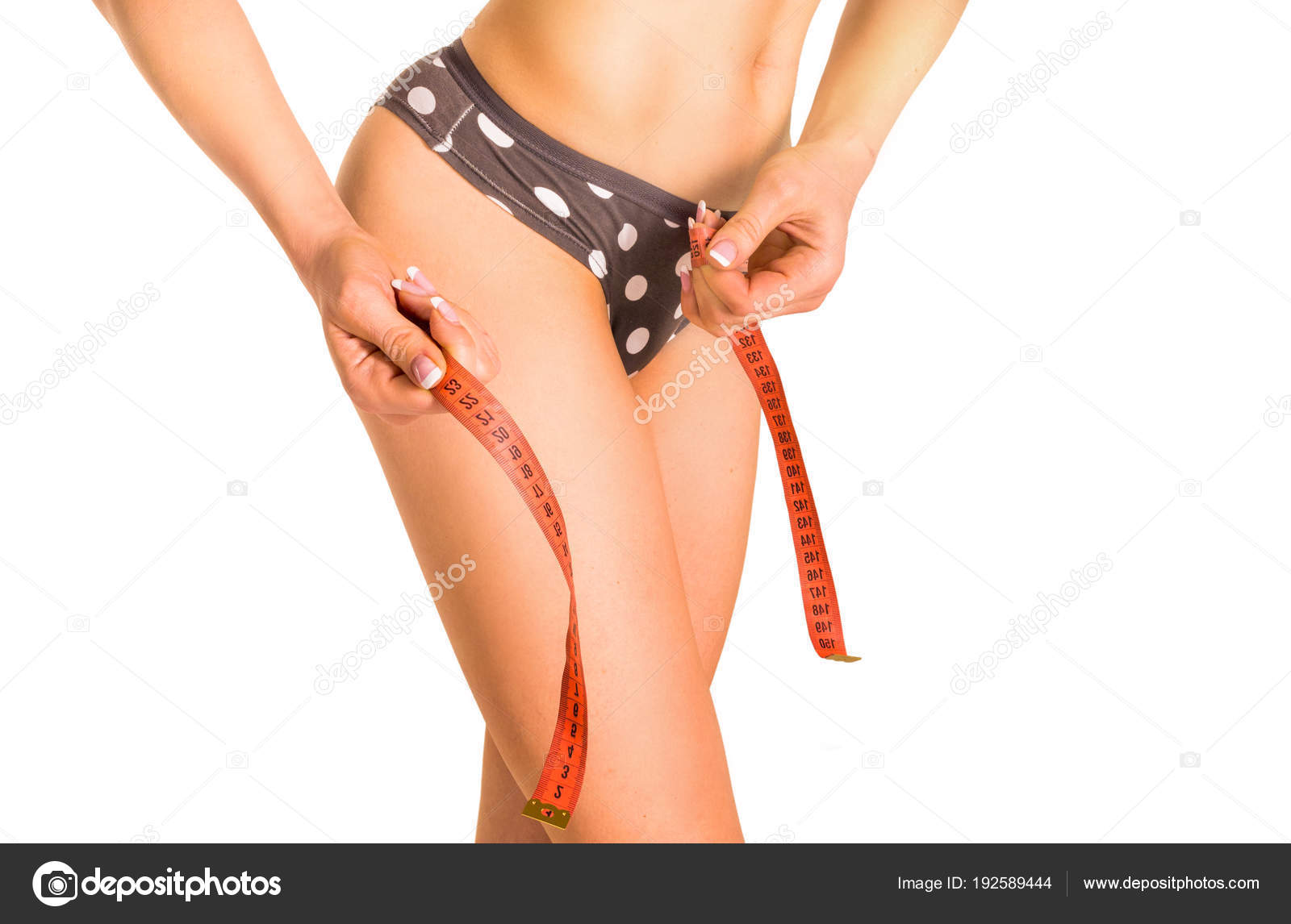 Young Woman Measures The Ass On White Background Stock Photo Young Woman Measures The Ass On White Background Stock Photo
