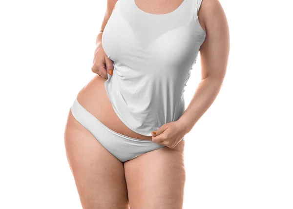 Товста жінка показує свою талію ізольовано на білому тлі . — стокове фото