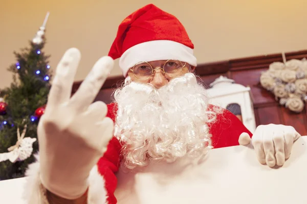Portrait of santa claus showing two fingers up — Stock Photo, Image