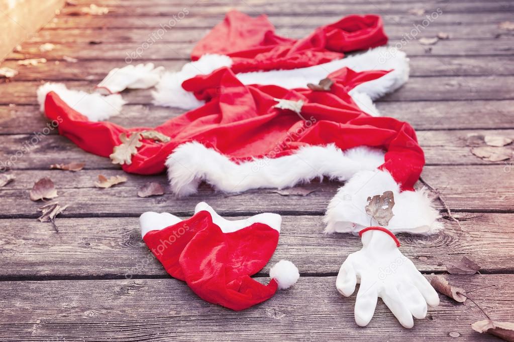 santa suit abandoned on a wooden floor