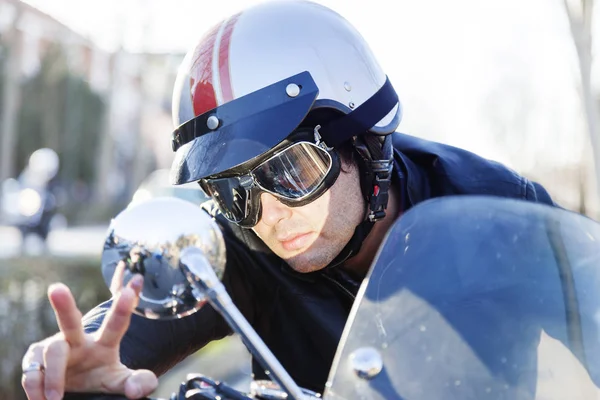 Portrait of young biker riding his motorcycle — Stock Photo, Image