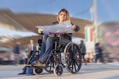 young lady in a wheelchair looking for a destination on map clipart