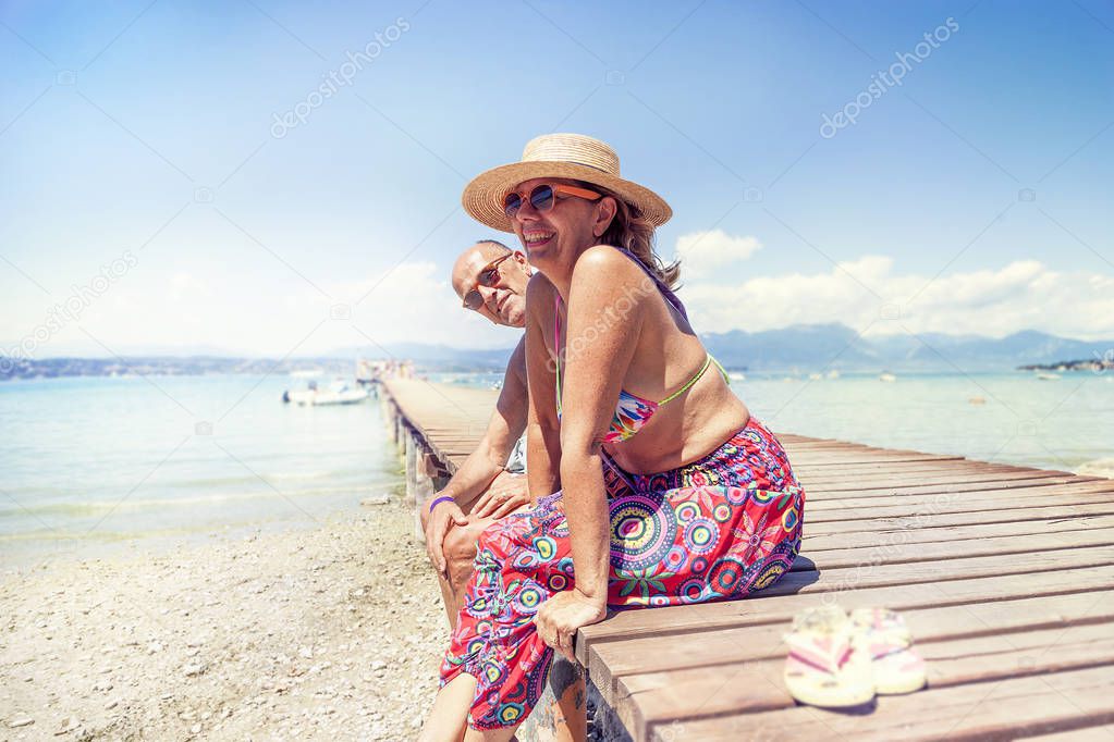 Portrait of modern mature couple relaxing in swimsuit
