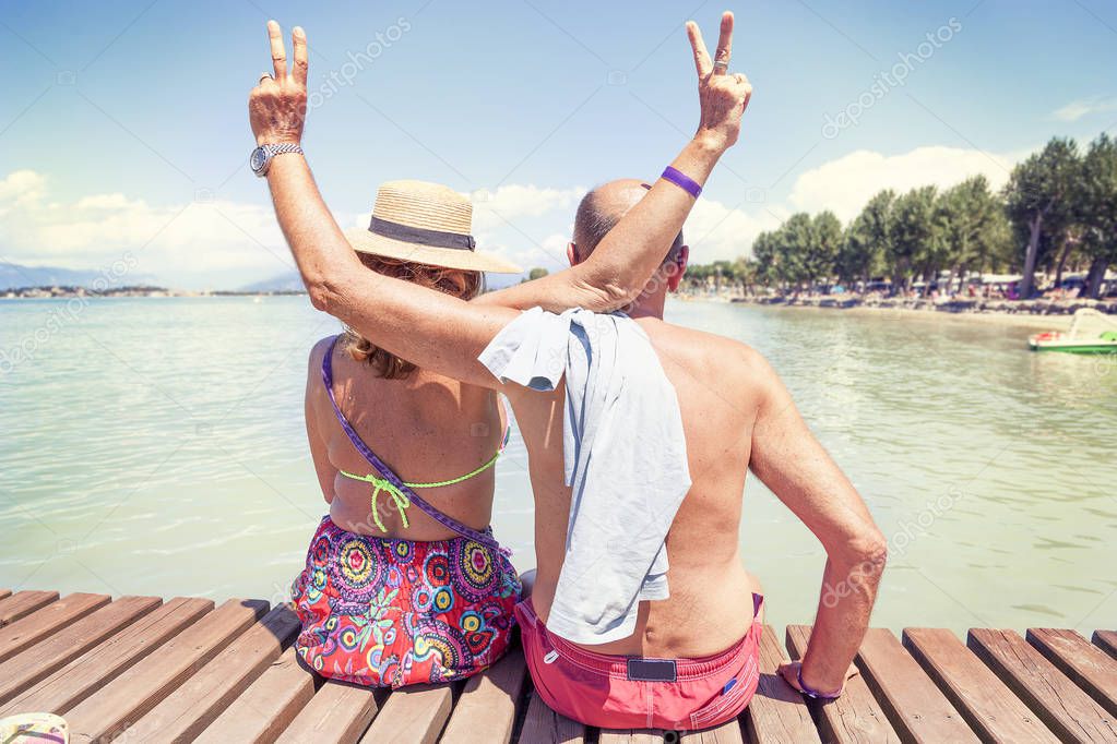 Portrait of modern mature couple relaxing in swimsuit