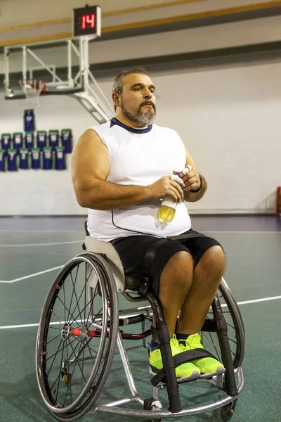 disabled sport men relaxation while playing basketball