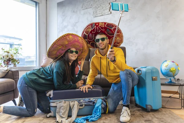 Young Couple Sitting Floor Home Takes Selfie Smartphone Wearing Colorful — Stock Photo, Image