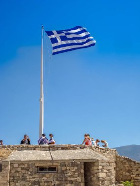 Greece flag at the Parthenon temple at the Acropoli clipart